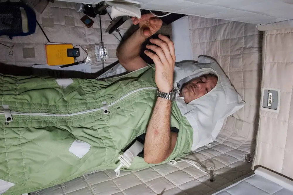 astronaut Luca Parmitano asleep on the ISS